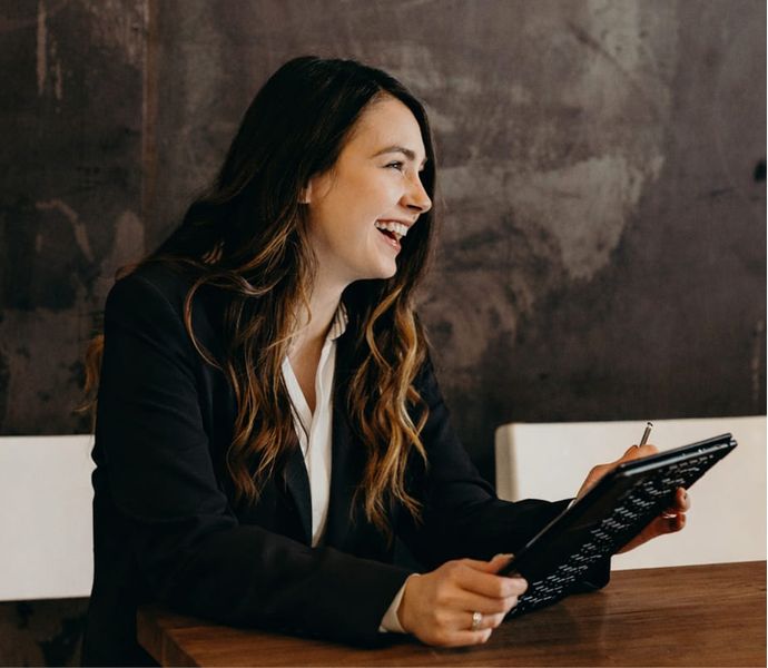 Woman with tablet looking at donation form
